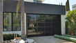 Contemporary Black Aluminum & Black Laminate (Privacy) Glass Garage Door